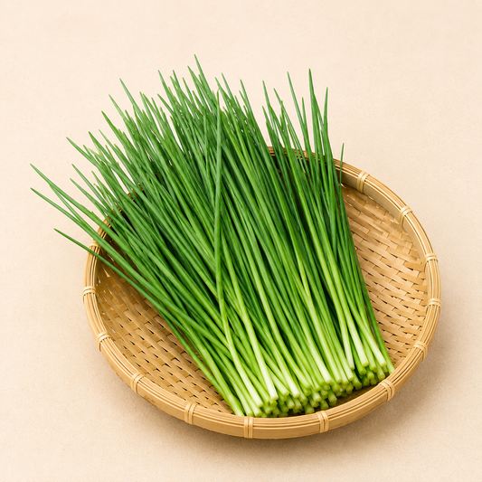 Fresh Chinese chives bundle in round woven basket